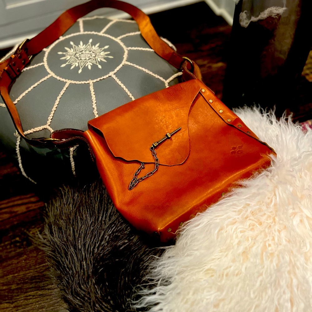 Gently used like New beautiful cognac brown genuine leather hobo bag.